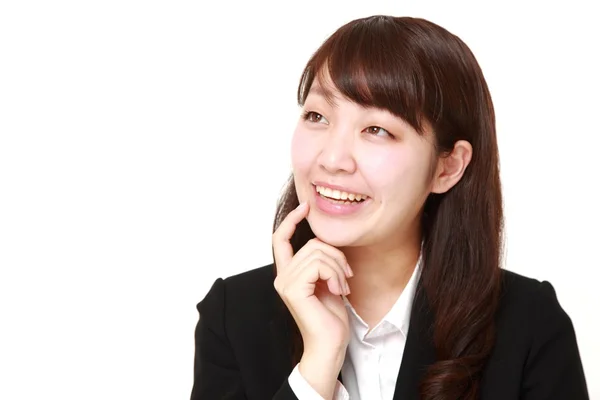 Young Japanese businesswoman dreaming at her future — Stock Photo, Image