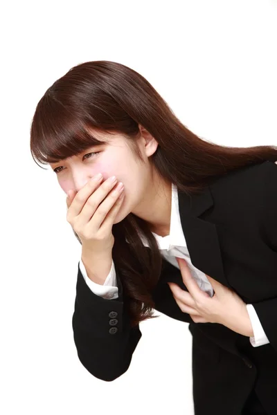 Mladí japonští podnikatelka pocit zvracení — Stock fotografie