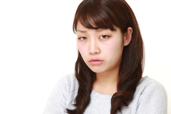 Junge Japanerin in schlechter Laune — Stockfoto