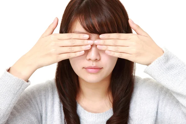 Woman covering her face with hands — Stock Photo, Image