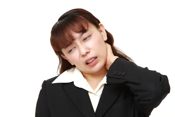 Asian businesswoman suffers from neck ache — Stock Photo, Image