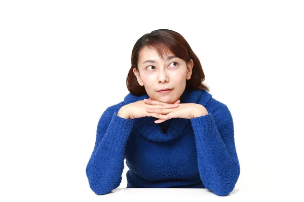 Asian woman thinks about something — Stock Photo, Image