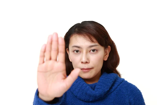Asian woman making stop gesture — Stock Photo, Image