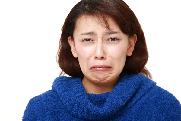 Mujer asiática con lágrimas de cocodrilo —  Fotos de Stock