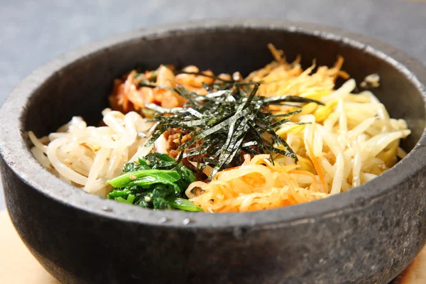 Bibimbap on a dinibg table — Stock Photo, Image