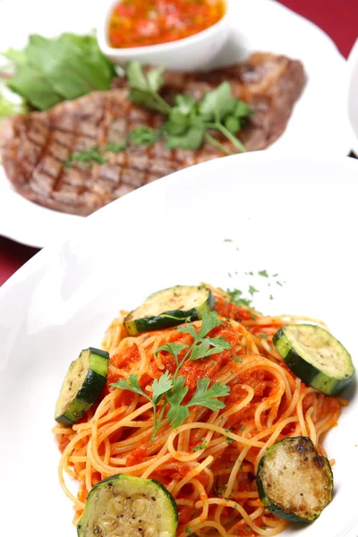 Tomato sauce pasta with beef steak — Stock Photo, Image