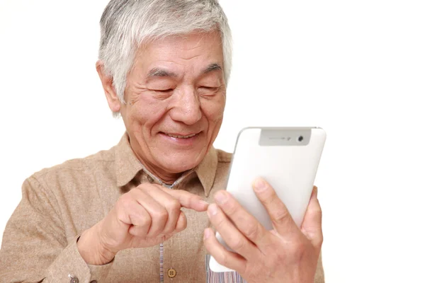 Senior Japanese man using tablet computer — Stock Photo, Image