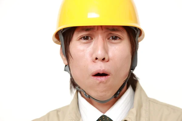 Young Japanese construction worker shocked — Stock Photo, Image