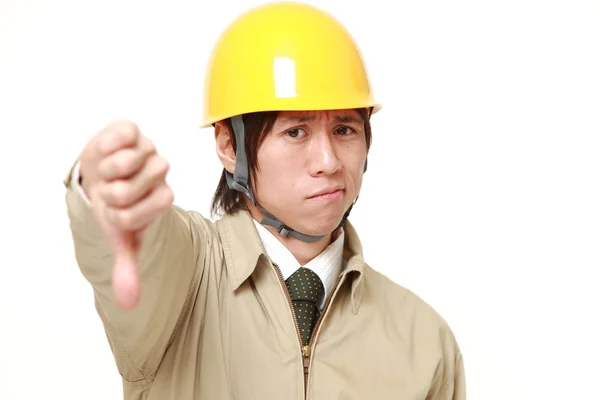 Mladá japonská stavební dělník s palec dolů gesto — Stock fotografie