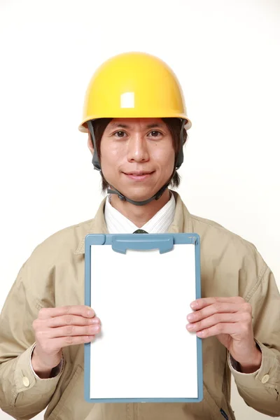 Japanese construction worker with clip board — Stock Photo, Image
