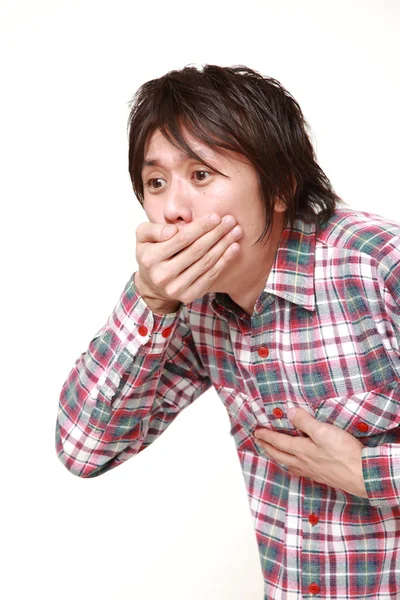 Joven japonés hombre se siente como vomitar — Foto de Stock