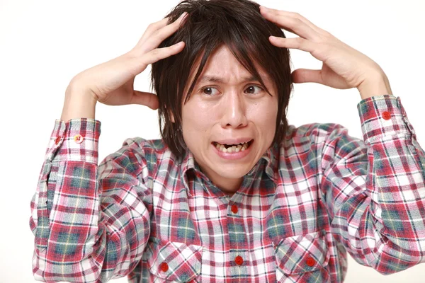 Paniek jonge Japanse man — Stockfoto