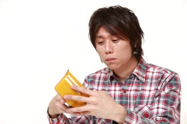 Arme jonge Japanse man — Stockfoto