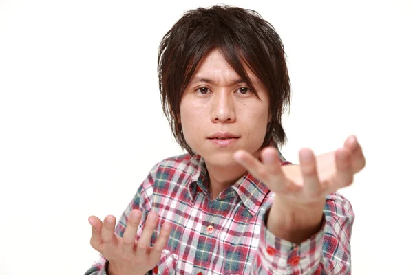 Young Japanese man requests something — Stock Photo, Image