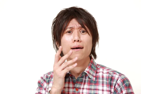 Young Japanese man shocked — Stock Photo, Image