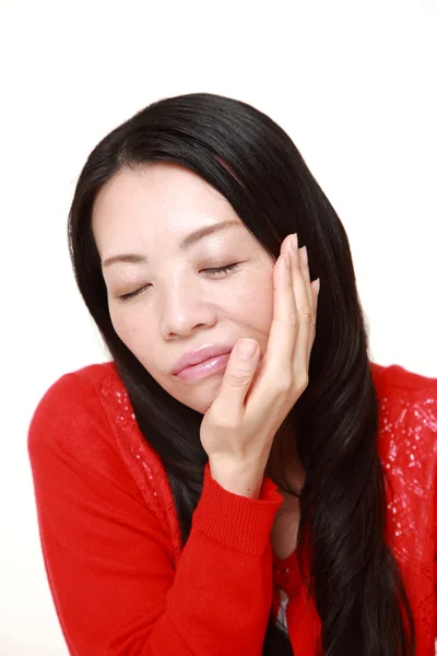 Japanese woman suffers from toothache — Stock Photo, Image