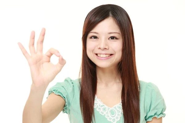 Young Japanese woman showing perfect sign — Stock Photo, Image