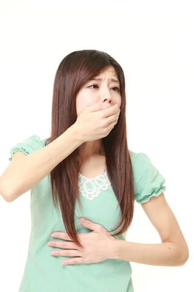Joven japonesa mujer se siente como vomitar — Foto de Stock