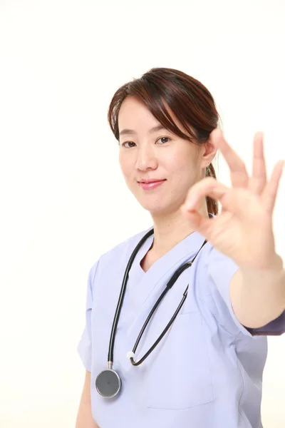 Japanese female doctor showing perfect sign — Stock Photo, Image