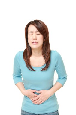 middle aged Japanese woman suffers from stomachache clipart