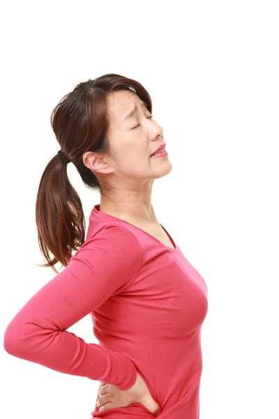 Japanese woman suffers from lumbago — Stock Photo, Image