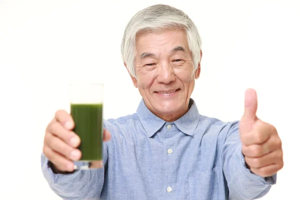 Senior Japanese man with green vegetable juice — Stock Photo, Image