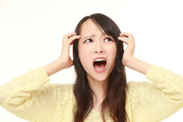 Young Japanese woman shocked — Stock Photo, Image