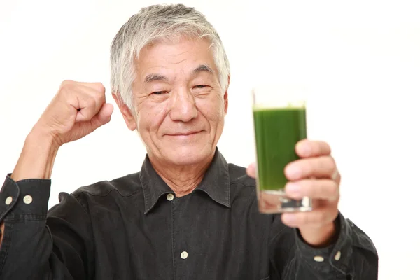 Senior Japanese man with green vegetable juice — Stock Photo, Image