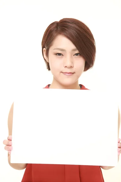 Giovane donna giapponese con bacheca — Foto Stock