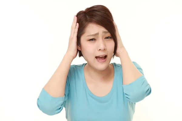 Young Japanese woman shocked — Stock Photo, Image