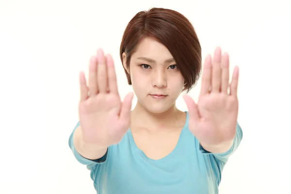 Junge Japanerin macht Stop-Geste — Stockfoto