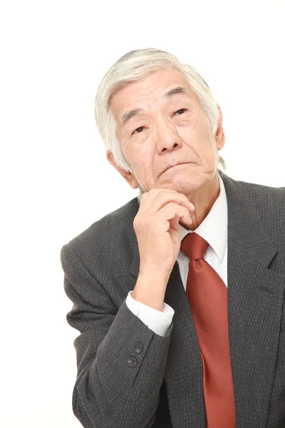 Senior Japanese businessman worries about something — Stock Photo, Image