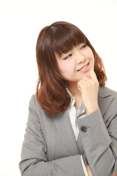 Young Japanese businesswoman dreaming at her future — Stock Photo, Image