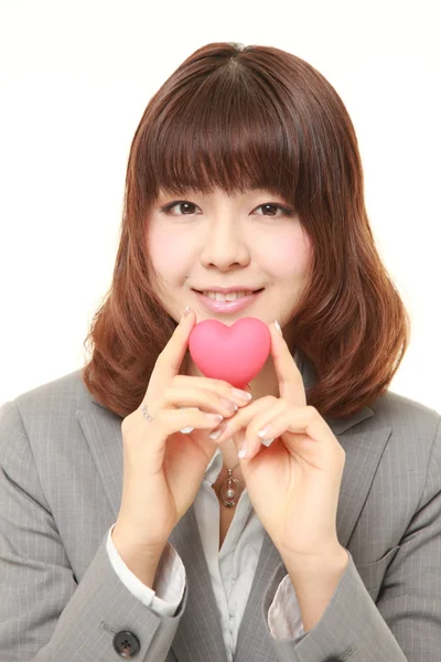 Japanese businesswoman with heart — Stock Photo, Image