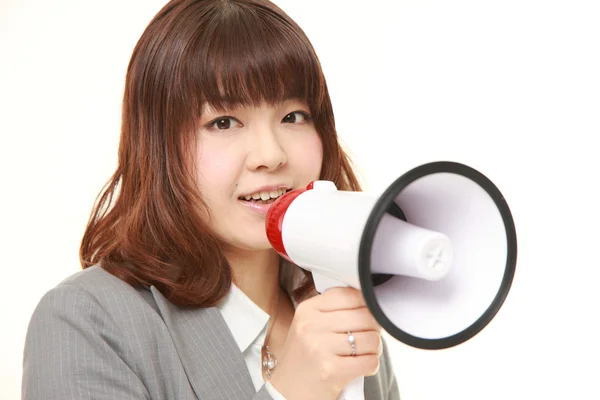 Joven mujer de negocios japonesa con megáfono — Foto de Stock