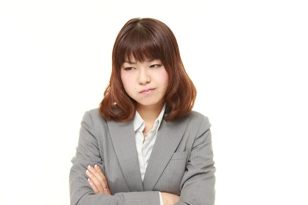 Jonge Japanse zakenvrouw in een slecht humeur — Stockfoto