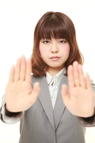 Joven japonesa mujer de negocios haciendo stop gesture —  Fotos de Stock