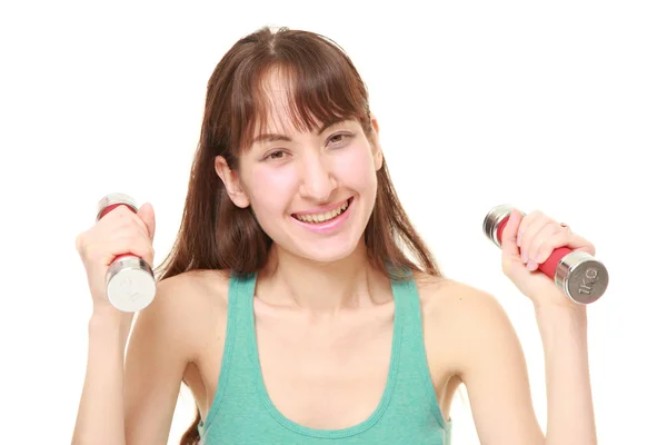 Woman doing dumbbll exercise — Stock Photo, Image