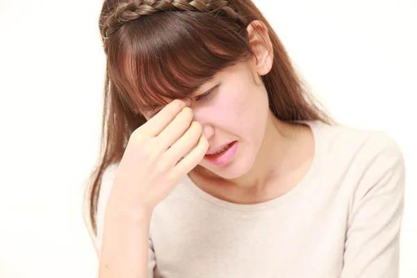 Young woman suffers from Asthenopia — Stock Photo, Image