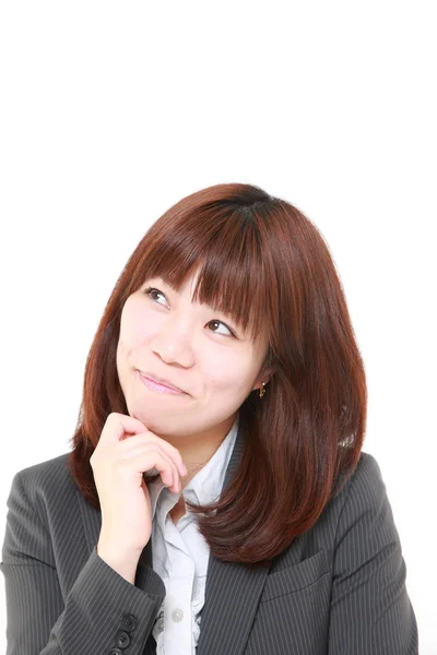 Young Japanese businesswoman dreaming at her future — Stock Photo, Image