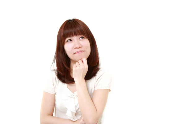 Jovem mulher japonesa sonhando com seu futuro — Fotografia de Stock