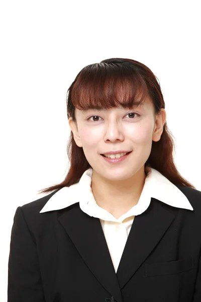 Unattractive Asian businesswoman smiles — Stock Photo, Image