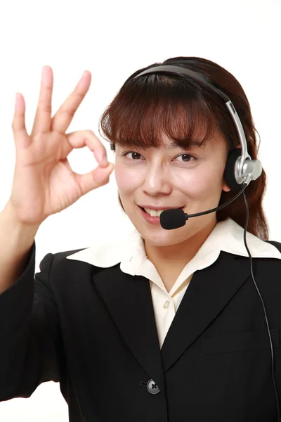 Asian businesswoman of call center with head sets — Stock Photo, Image