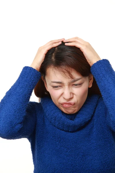 Perplexed woman on white background — Stock Photo, Image