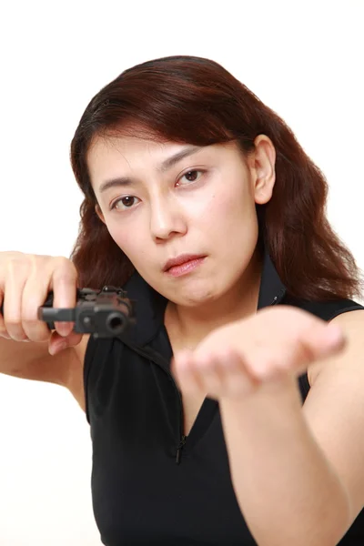 Female robber with a handgun — Stock Photo, Image