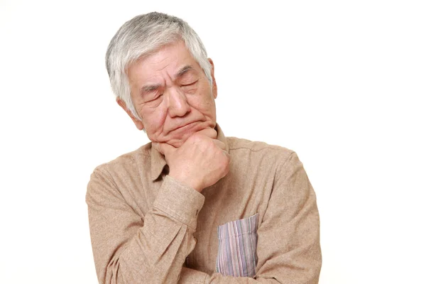 Senior Japanese man worries about something — Stock Photo, Image