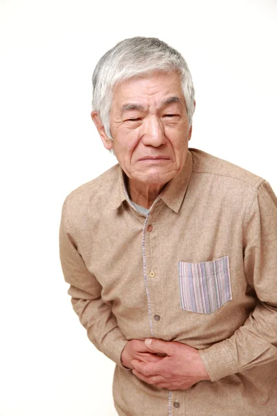 Mayor japonés hombre sufre de dolor de estómago —  Fotos de Stock