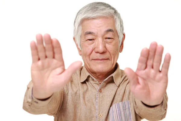 Senior japonés hombre haciendo stop gesture —  Fotos de Stock