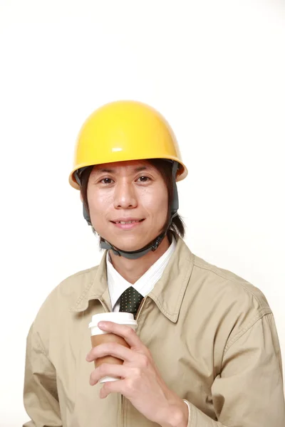 Japanse bouwvakker neemt een koffie pauze — Stockfoto