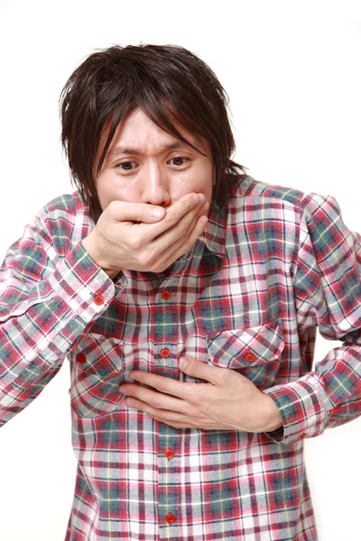 Joven japonés hombre se siente como vomitar — Foto de Stock